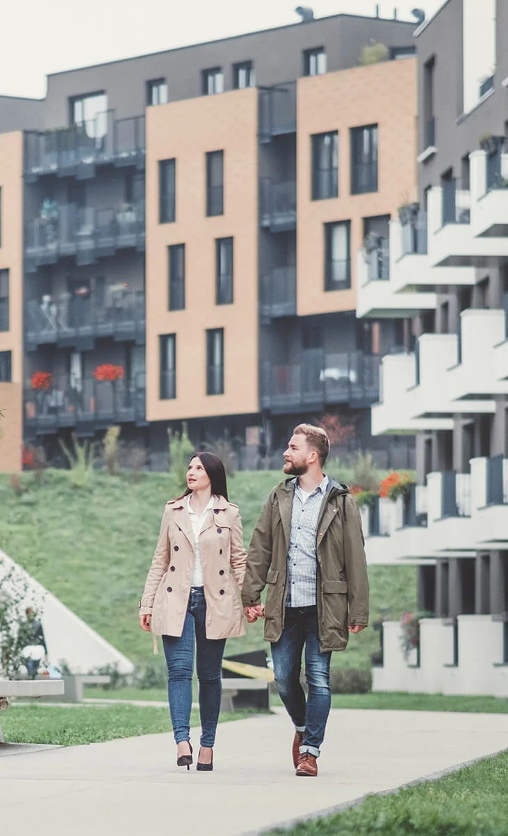 apartment fund image - couple walking on an apartment development.